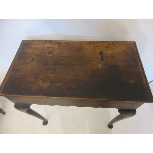 57 - Neat sized antique oak table having carved freize and sides and raised on four pad feet. W. 73cm, D.... 