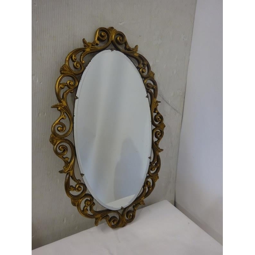 9 - Decorative hall mirror. H. 77cm, W. 49cm approx.