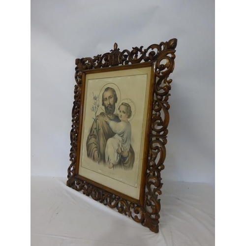 10 - Large coloured print of St. Joseph and Child in decorative carved oak frame. Overall size - 106cm x ... 