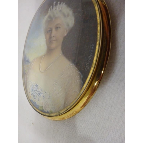 114 - Miniature brass framed oval portrait of a lady with tiara.