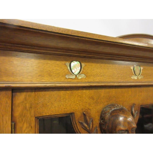 117 - A good Victorian Arts & Crafts oak cabinet bookcase, the stepped top with a moulded and arched back ... 