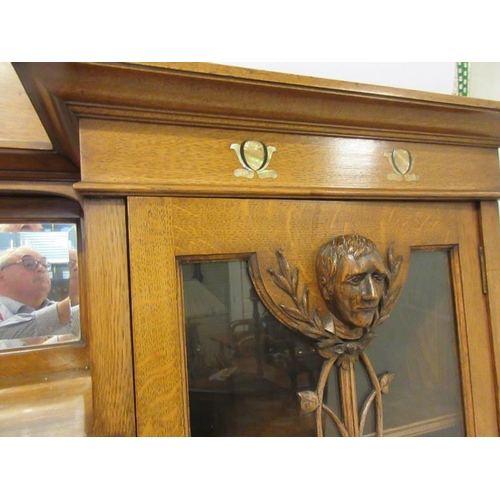 117 - A good Victorian Arts & Crafts oak cabinet bookcase, the stepped top with a moulded and arched back ... 