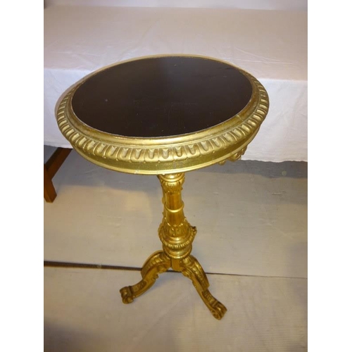 118 - Victorian gilded circular table on centre column and tripod base. H. 87cm approx. Diameter 46cm.