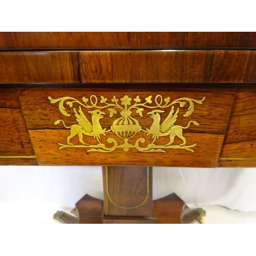 153 - A rosewood and brass inlaid fold over card table raised on centre column platform base on four splay... 