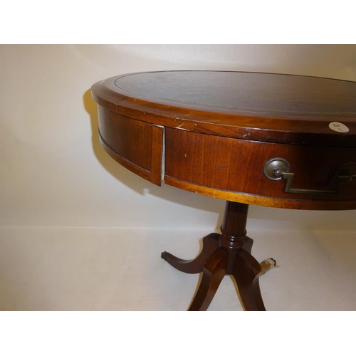 185 - Circular occasional table with leather inset top.  Diameter 67cm H. 73cm.