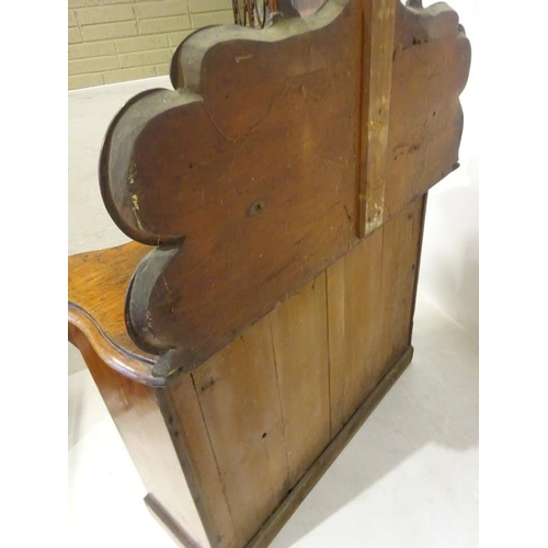 194 - Victorian mahogany side cabinet having carved back with shelf, serpentine shaped drawer over two doo... 