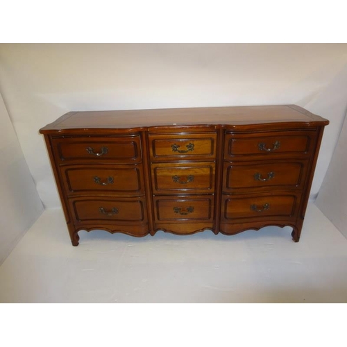 212 - An American cherry wood long chest fitted with nine drawers. (Rway) W. 165cm, D. 50cm, H. 85cm appro... 