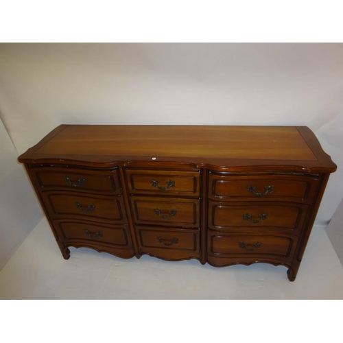 212 - An American cherry wood long chest fitted with nine drawers. (Rway) W. 165cm, D. 50cm, H. 85cm appro... 