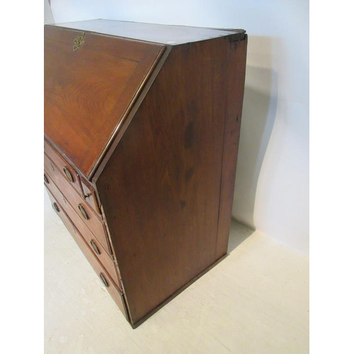 219 - An 18th century Virginia walnut writing bureau, the slope front revealing a fitted interior over one... 