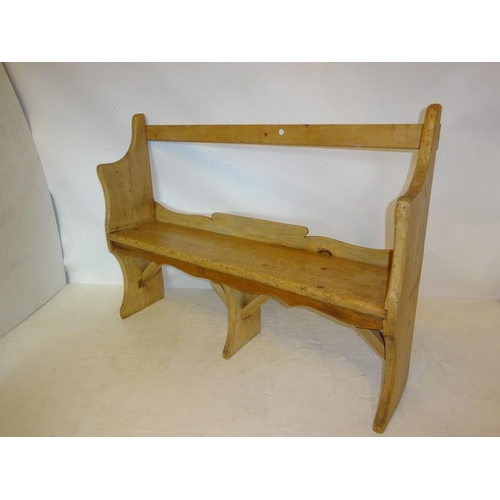 37 - Old pine bar back bench. W. 130cm, H. 95cm, D. 29cm approx.