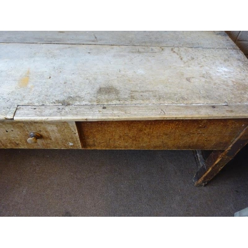 48 - Large antique pine laundry table fitted with a centre drawer and having twin cross stretchers. 255cm... 