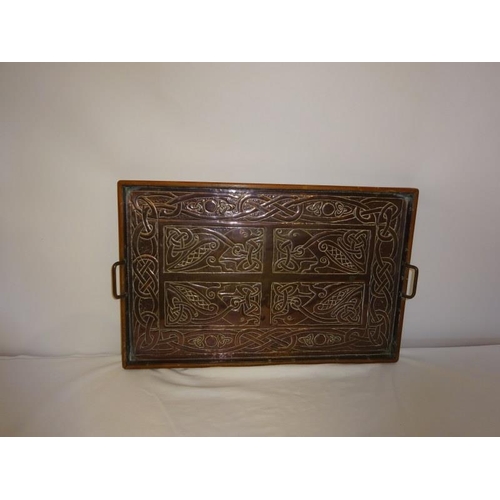 52 - A Celtic design copper framed plaque in the form of a tray. 54cm x 34cm approx.