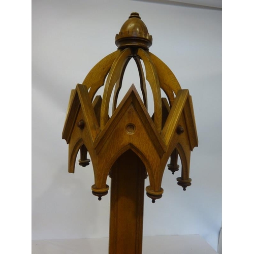 53 - A slim tall oak statue stand in the gothic style. H. 200cm, Diameter 35cm approx.