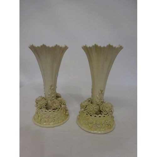 54 - A pair of decorative Belleek vases with black mark. H. 30cm approx.