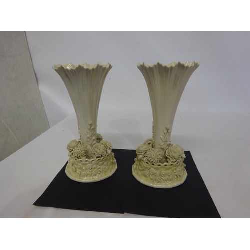 54 - A pair of decorative Belleek vases with black mark. H. 30cm approx.