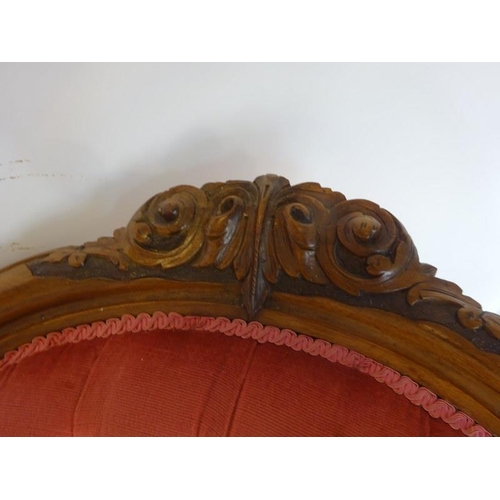 60 - A Victorian walnut framed drawing room couch, the back having three oval shaped panels over serpenti... 