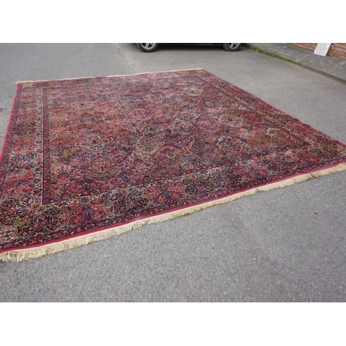 76 - A large Karstan American rug. 350cm x 380cm approx.