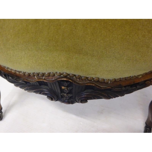 80 - A pair of antique French carved rosewood drawing room easy chairs having open arms and raised on cab... 