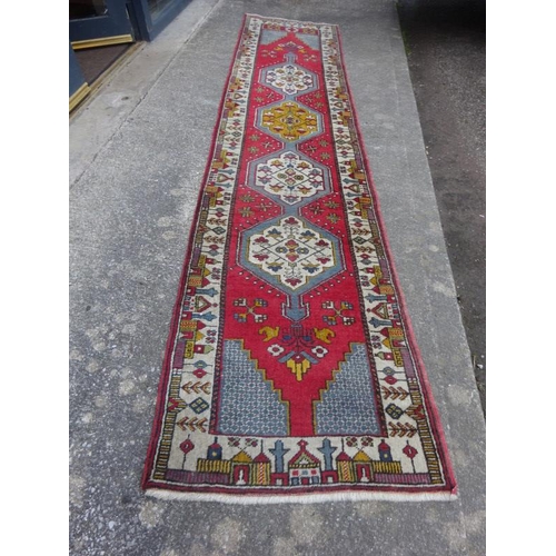 82 - Turkish runner rug. Length 328cm, W. 73cm approx.