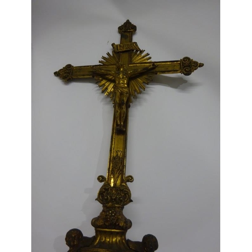 98 - A gilded brass Crucifix on long brass pole.