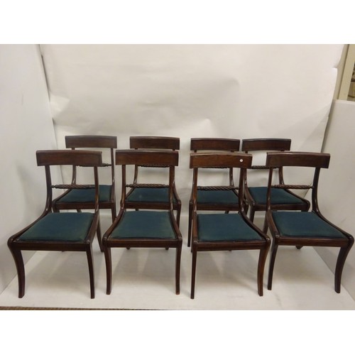 281 - A set of 8 Regency mahogany dining chairs, the backs with rope twist bar and raised on sabre legs.