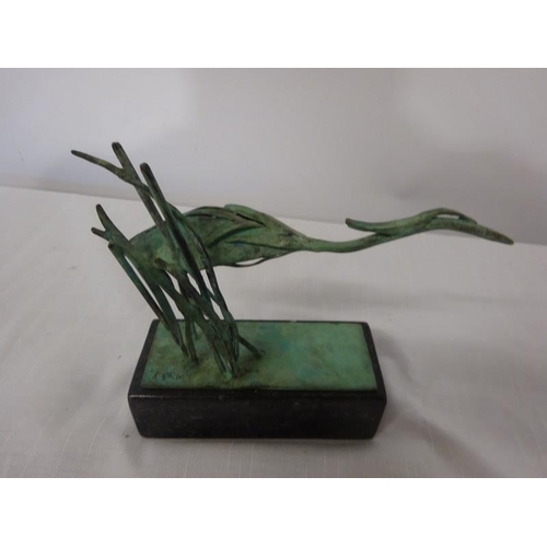 107 - Sculpture of a bird on marble base.