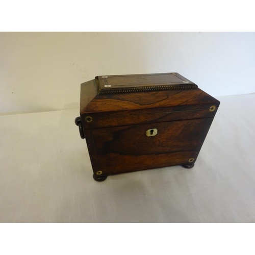 109 - Neat sized Regency rosewood tea caddy with mother of pearl decoration.