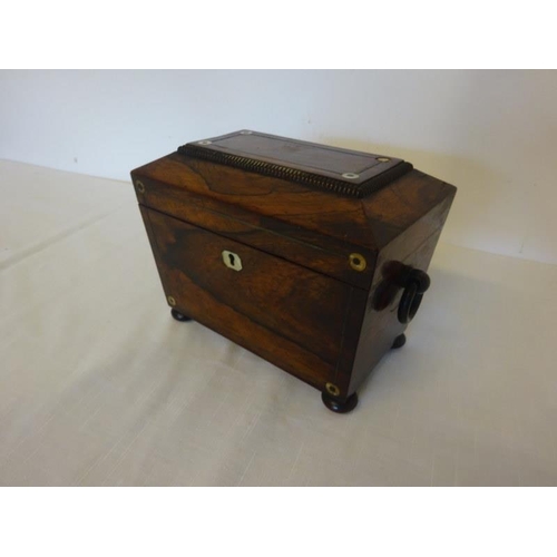 109 - Neat sized Regency rosewood tea caddy with mother of pearl decoration.