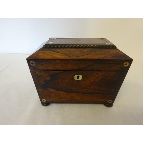 109 - Neat sized Regency rosewood tea caddy with mother of pearl decoration.