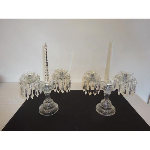 115 - A pair of Waterford glass table candleabra.