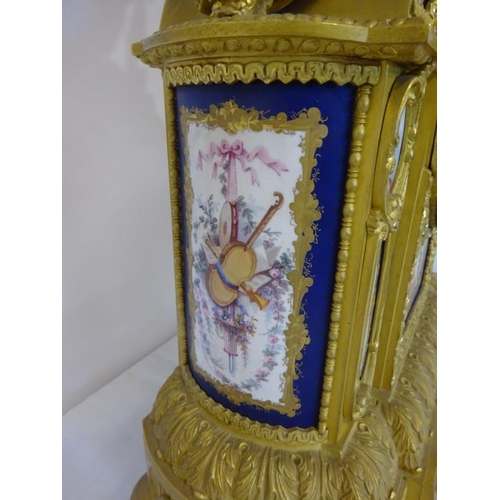 126 - A fine antique French ormulu mantle clock decorated throughout with serves panels, very original. Ov... 