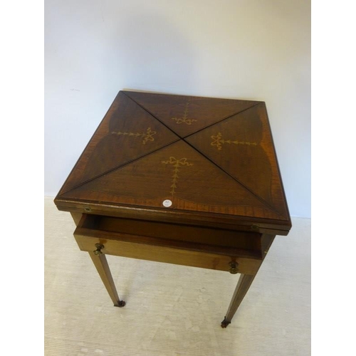 155 - Edwardian inlaid mahogany envelope card table fitted with a drawer and raised on tapered legs.