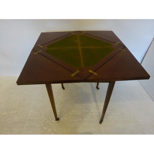 155 - Edwardian inlaid mahogany envelope card table fitted with a drawer and raised on tapered legs.