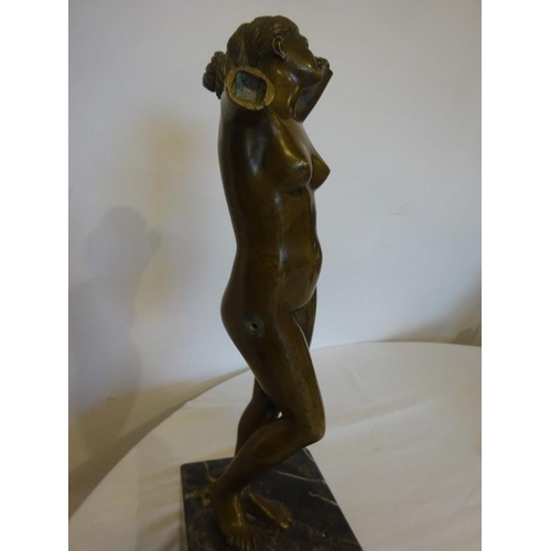 156 - Bronze figure of a nude lady on marble base. Height of figure 35 cm approx.