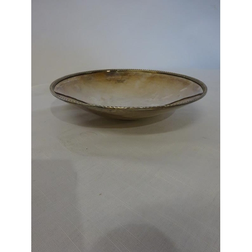 178 - A silver plated circular shaped dish by William Egan, Cork and a plated jug. (2)