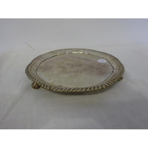 182 - Early English silver salver with rope edge border and raised on feet, London 1771. Diameter 7 1/2 