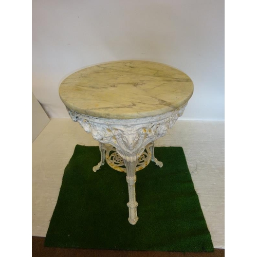 201 - Antique cast iron garden table with marble top. Diameter 64cm approx.