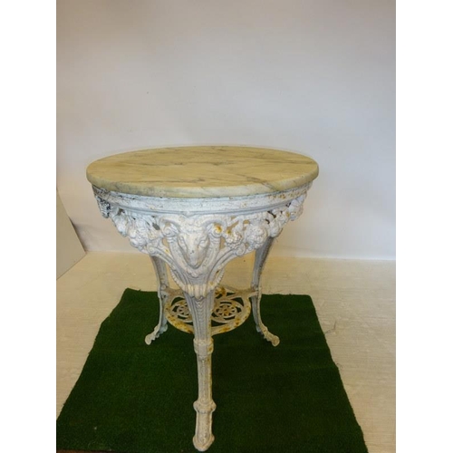 201 - Antique cast iron garden table with marble top. Diameter 64cm approx.