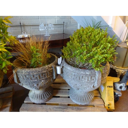 205 - A pair of large stone garden urns having Greek key decoration and fluted circular bases. H. 65cm, di... 