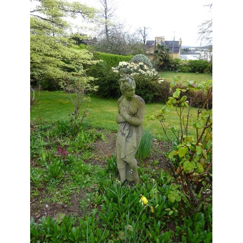 209 - Garden statue of a lady on circular base. H. 122cm approx.