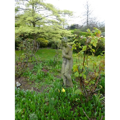 209 - Garden statue of a lady on circular base. H. 122cm approx.