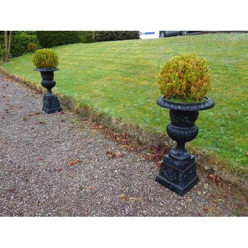 210 - Pair of large antique cast iron garden urns and bases. H. 110cm, Diameter 58cm approx.