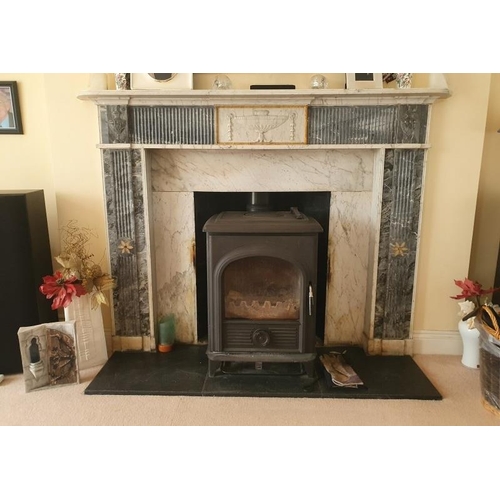 230 - A good Irish Georgian marble fireplace having Adams urn centre plaque, fluted columns with smaller u... 