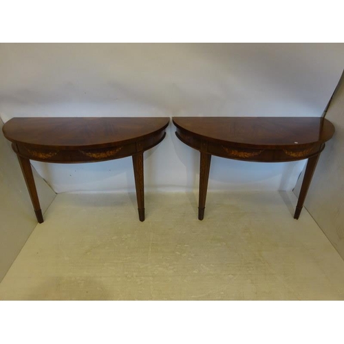 245 - A pair of inlaid mahogany console tables in the Georgian style. W. 127cm, D. 66cm, H. 76cm approx.