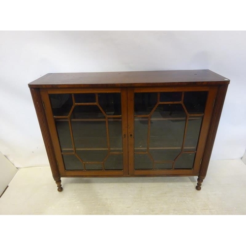 249 - Antique mahogany two door cabinet with fluted side pillars. W. 127cm, D. 36cm, H. 96cm approx.