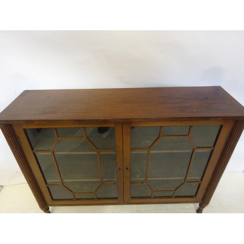 249 - Antique mahogany two door cabinet with fluted side pillars. W. 127cm, D. 36cm, H. 96cm approx.