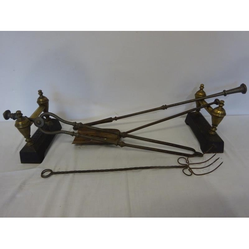 258 - Antique steel fire implements with brass and metal fire dogs.