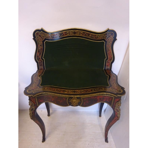 264 - An 19th century French boulle card table, the shaped top raised on brass mounted cabriole legs. W. 8... 