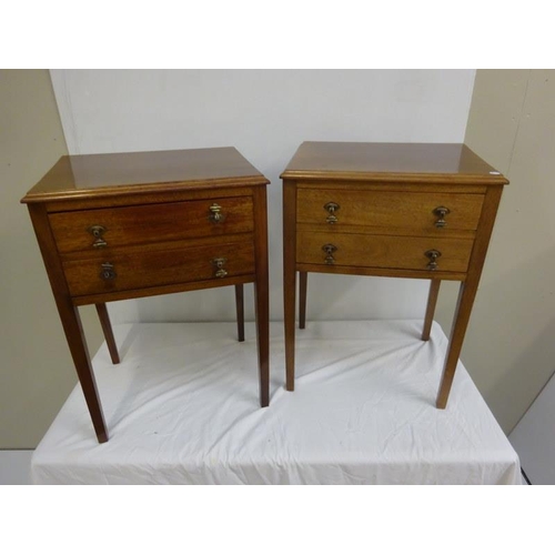 279 - A pair of neat sized mahogany bedside/lamp tables fitted with two drawers and raised on square legs.