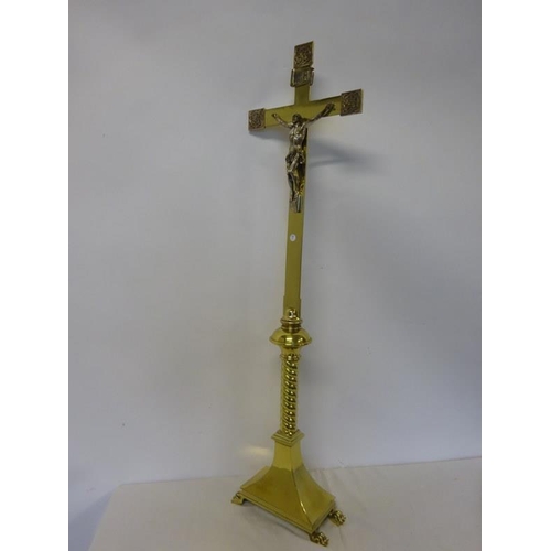 282 - Tall brass crucifix on stand. H. 130cm approx.